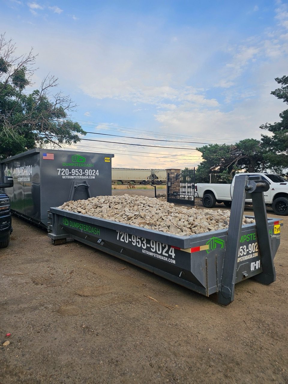 Roll-off bin filled with broken concrete, ready to haul away